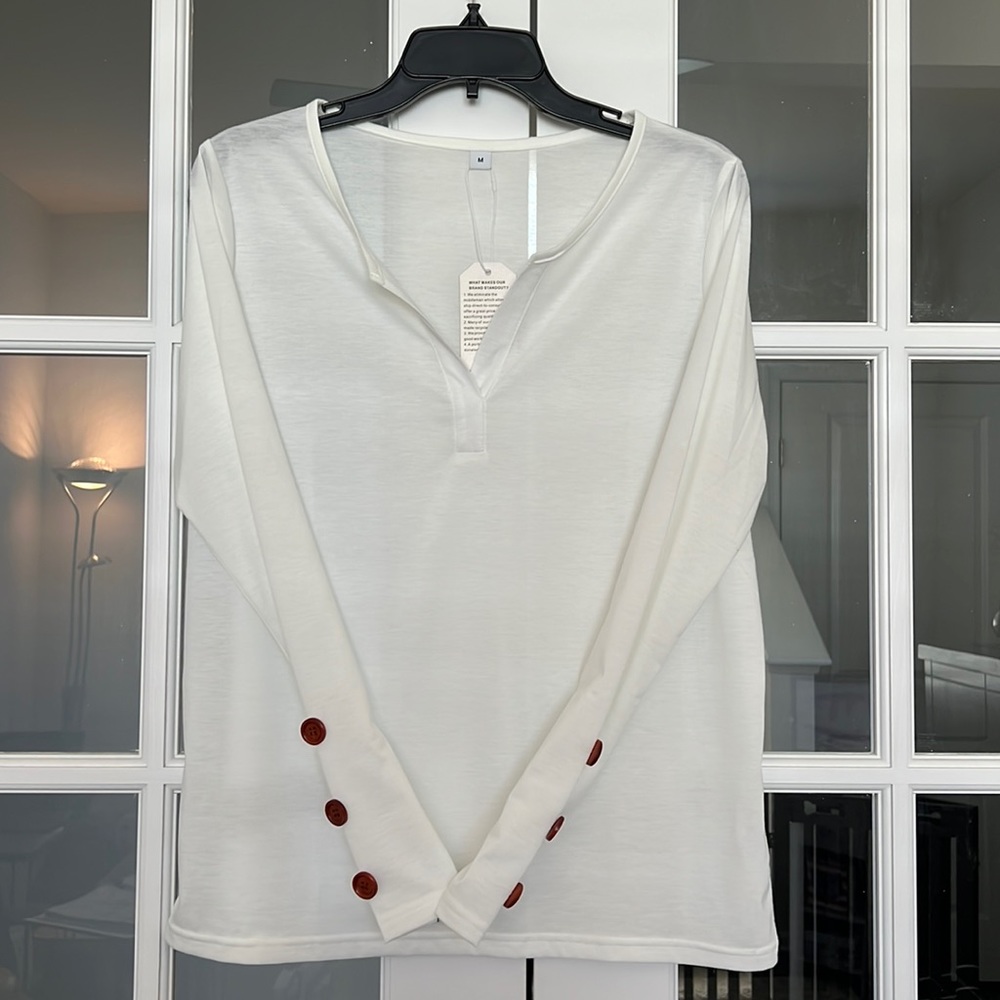 Long sleeve, Cream, Tunic style shirt with button accents on sleeve. NWT Medium